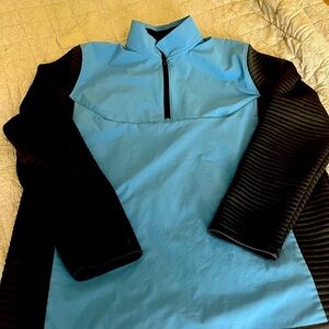 Under Armour Storm Golf Cold Gear Men’s 1/4 zip jacket.  Men’s large